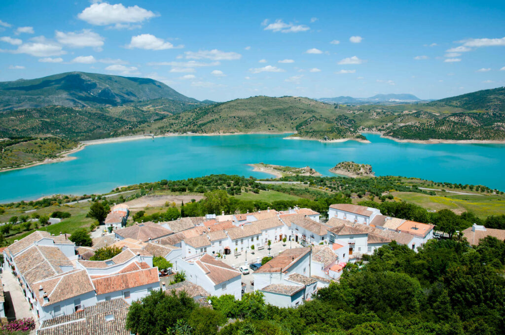 High-angle view of the townscape beside the mountains under the sky